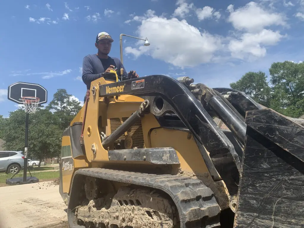 Vermeer mini skid steer run by operator on jobsite